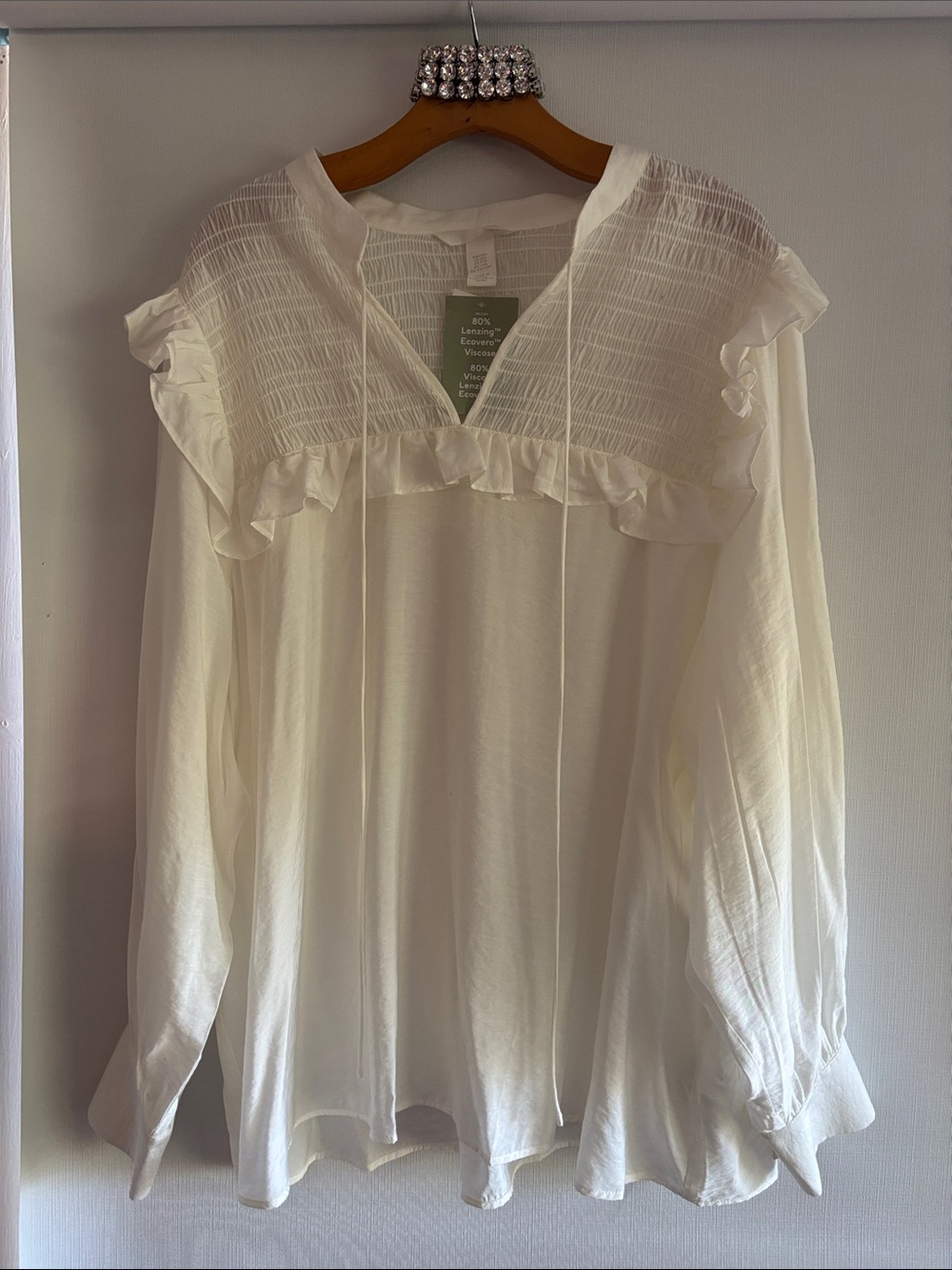 H&M white ruffled and smocked top.